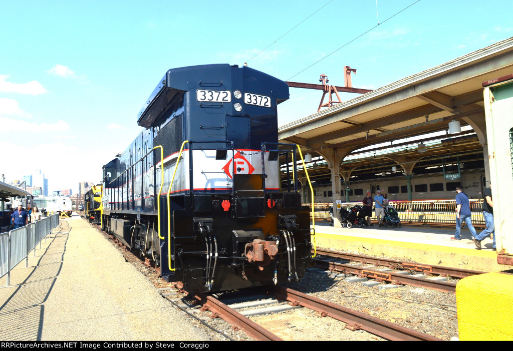 Long hood to cab shot EL 3372 /partial shot on NJT 4210 Erie HU